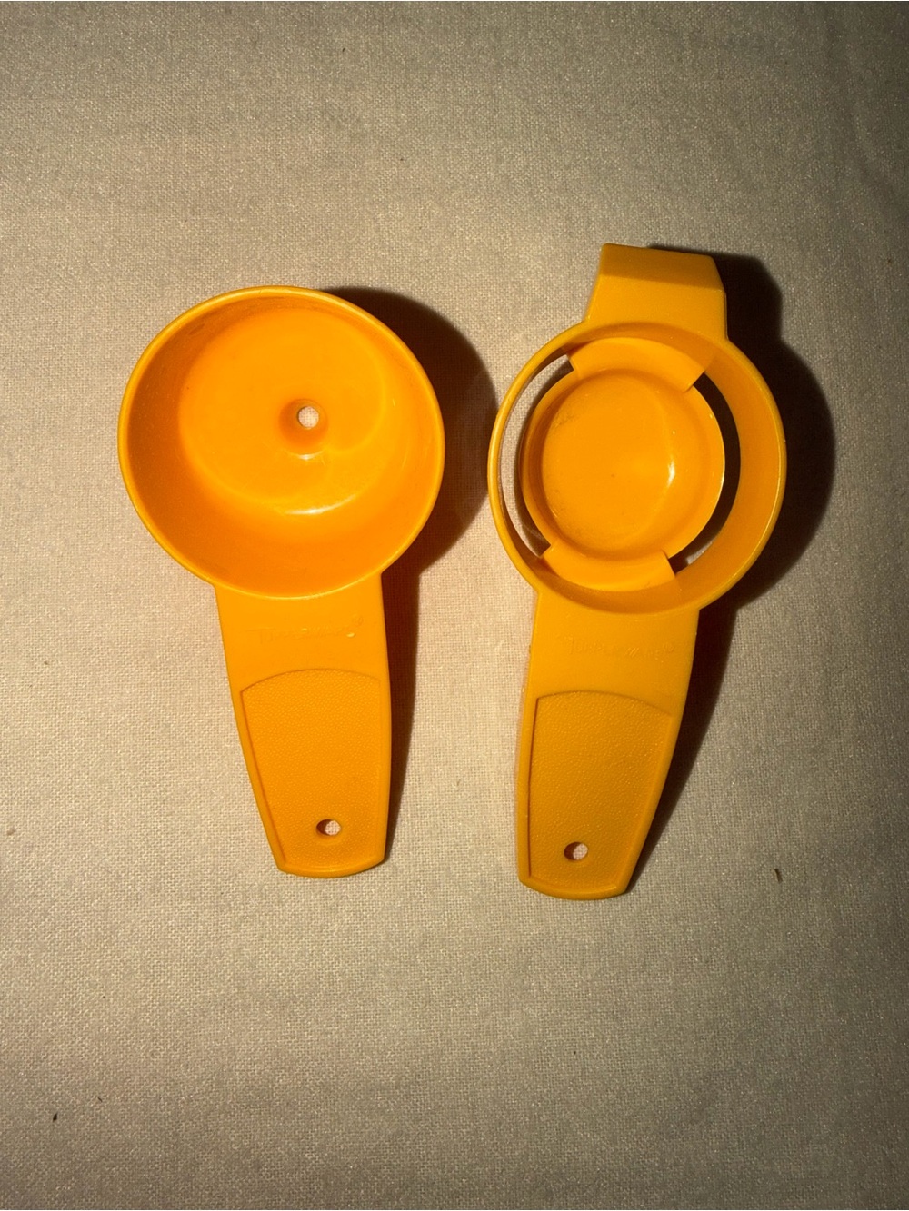 Vintage Tupperware funnel and egg separator.